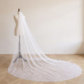 The Margaux veil on a dress form, soft daylight