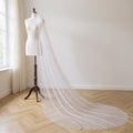 The Sylvie veil on a dress form, soft daylight